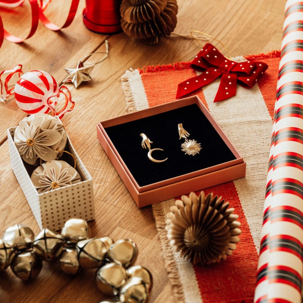 Christmas gift wrapping still life with jewelry for her