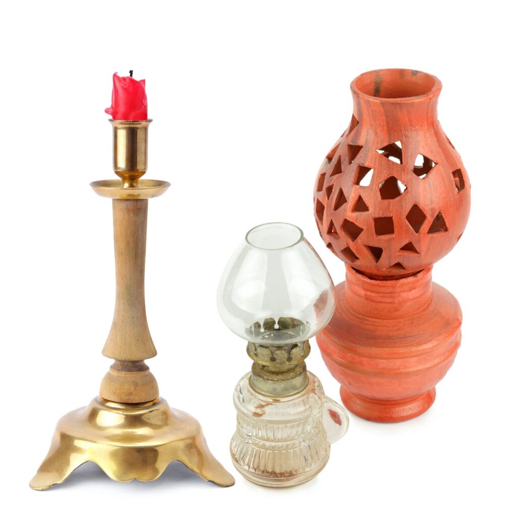 Collection of Vintage Lighting Objects Including Brass Candlestick and Kerosene Lamp